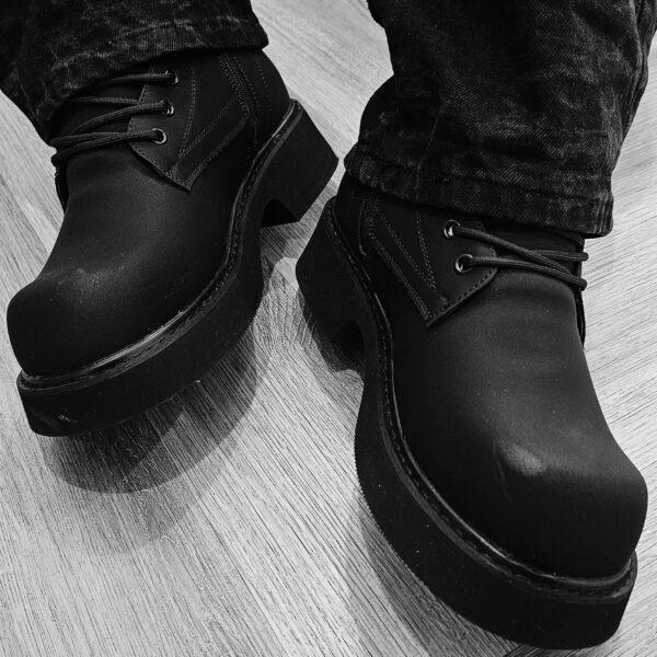 Black chunky-soled combat boots.